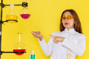 The illustration depicts the one female organic chemistry student engage in addition reactions experiments